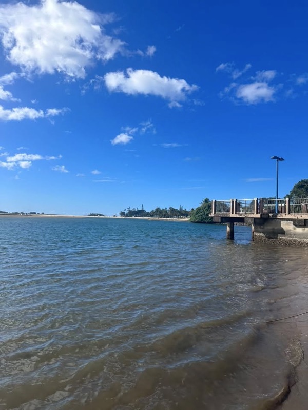 Cotton Tree beach on the Sunshine Coast at low tide on a sunny afternoon