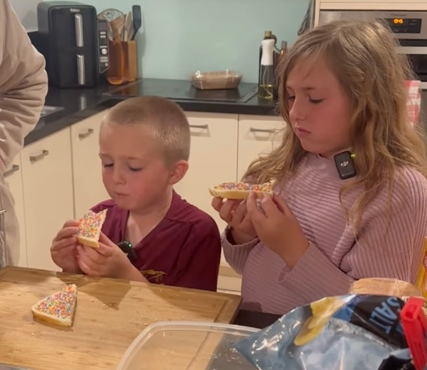 Kids tasting Australian fairybread for the first time with cautious, uncertain expressions