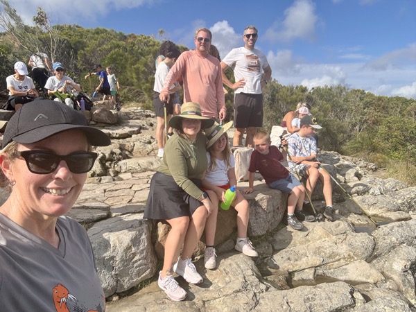 Group photo at the summit of Mount Coolum wearing Bunnings hats, Sunshine Coast