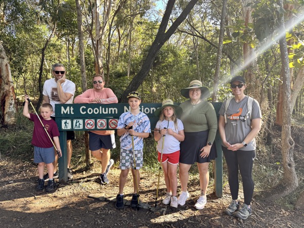Group photo at the Mount Coolum National Park sign at the start of the hiking trail