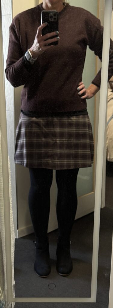 Brown skirt, brown sweater, black boots