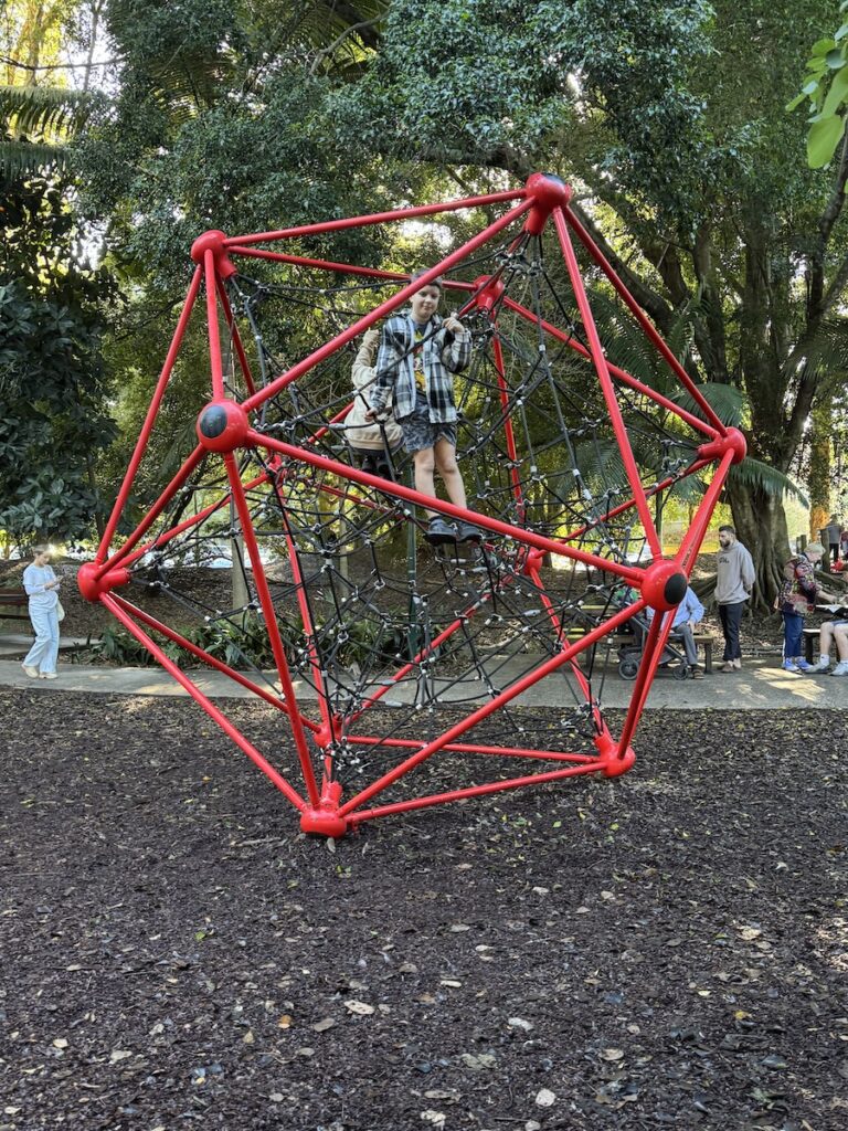Child climbing a frame in a playground