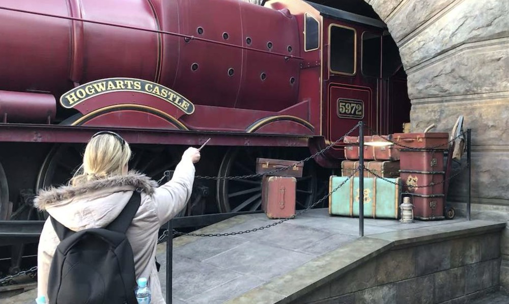 Kelly posing with a Harry Potter interactive wand at Hogsmeade, Universal Studios Japan