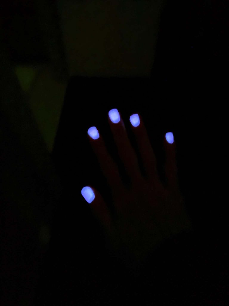 Pink Glamrdip dip powder nails glowing in the dark