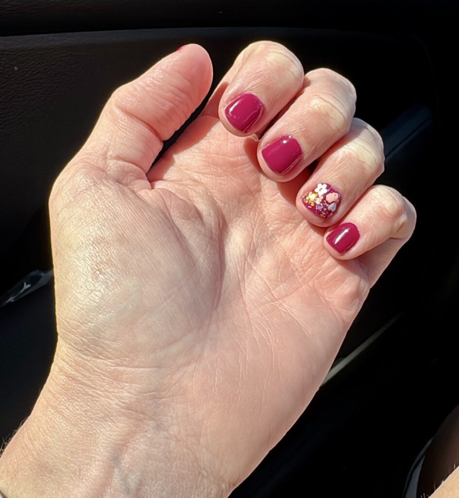     Burgundy Glamrdip manicure with glitter accent nail